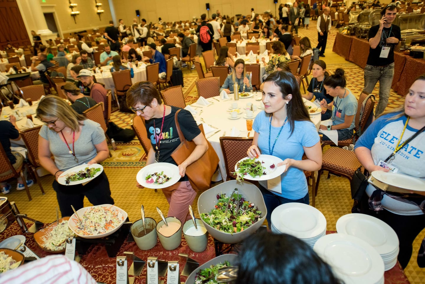 Employees serving themselves from a buffet line in a Caesars Palace ballroom