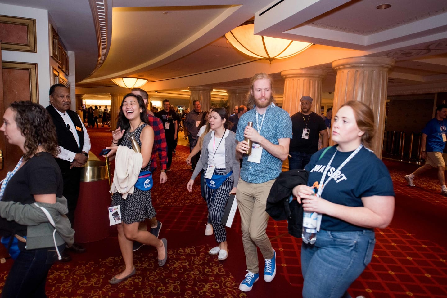 Employees walking together through the hotel toward the theatre