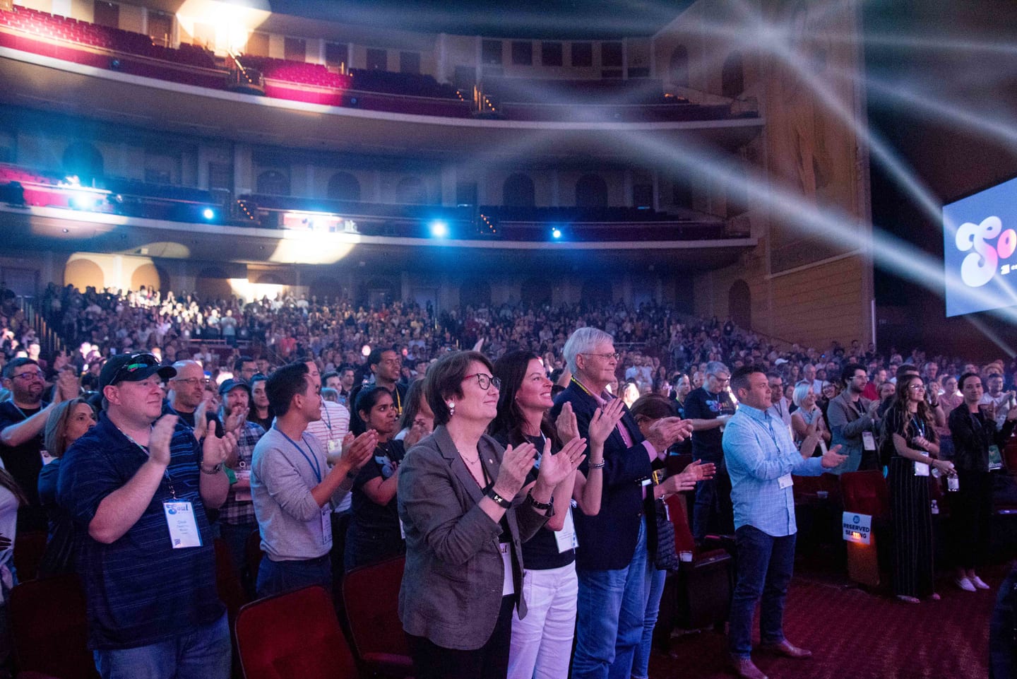 The Colosseum audience on its feet applauding at the end of a general session