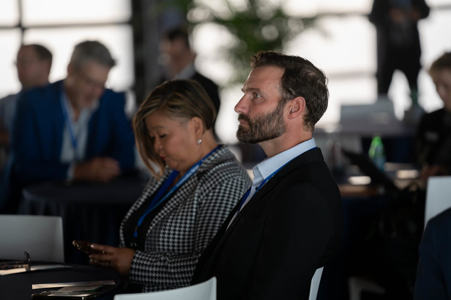 Three attendees listening closely from the audience at the Automotive News Congress: Los Angeles, City Market Social House