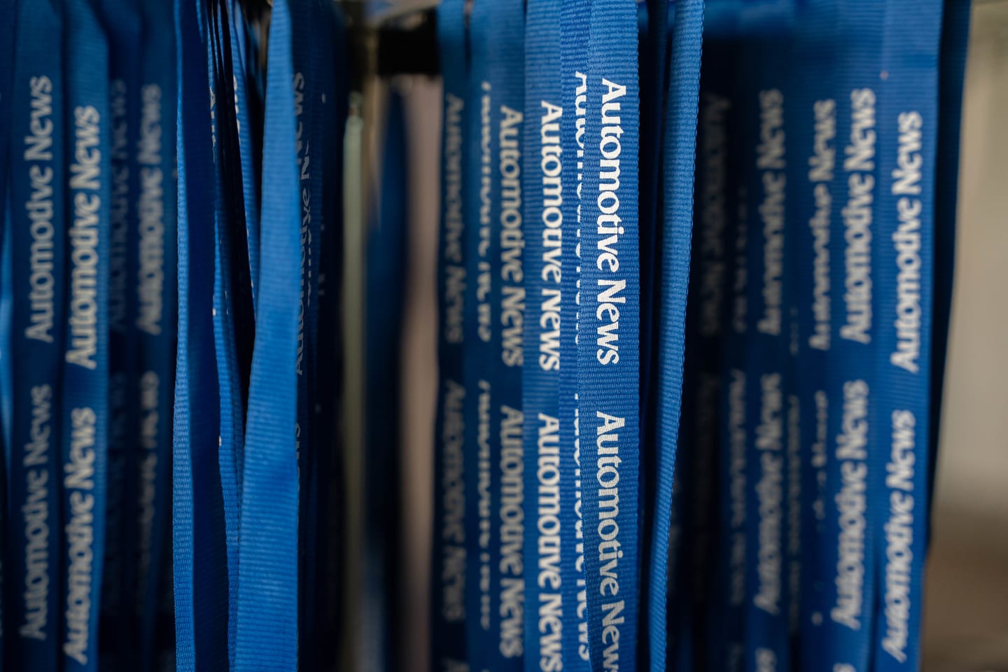 A close view of blue Automotive News branded lanyards ready for attendees at the Automotive News Congress: Los Angeles, City Market Social House