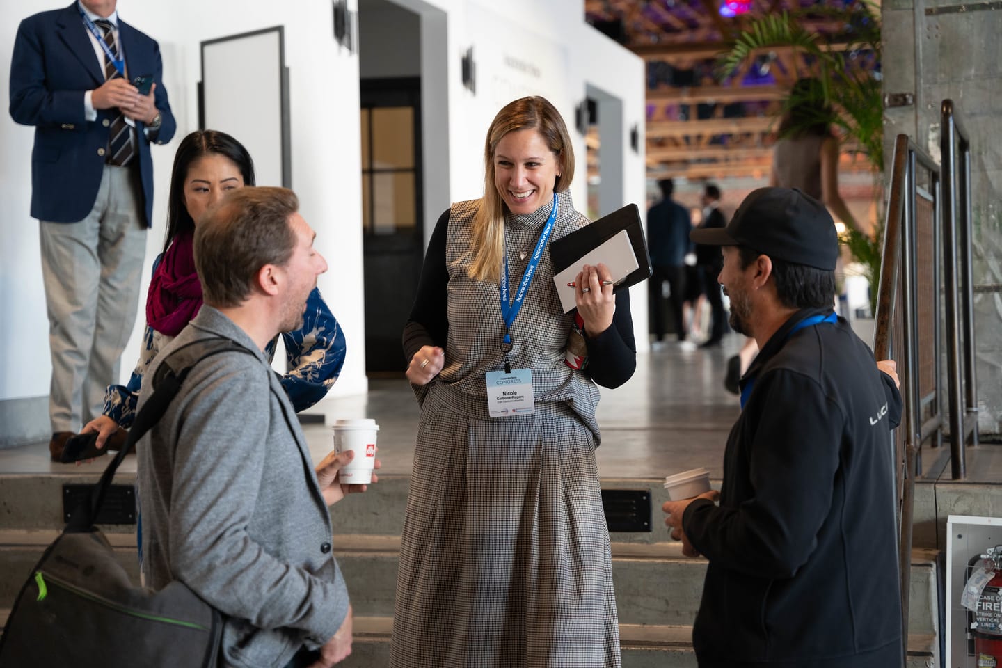 Attendees standing in conversation during the networking break at the Automotive News Congress: Los Angeles, City Market Social House