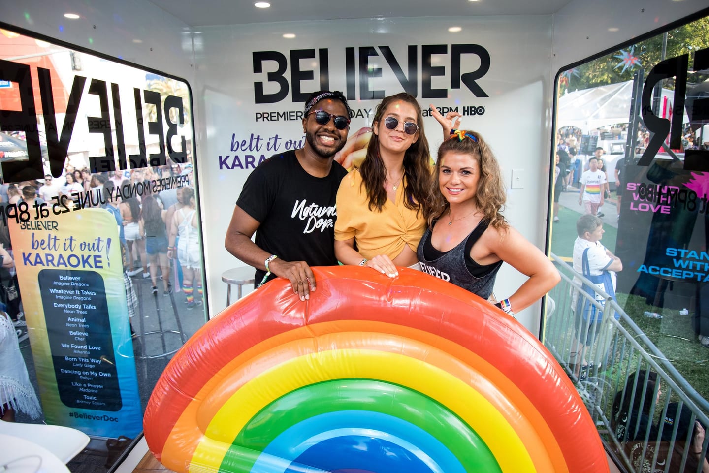 Guests with a rainbow float at the Believer premiere