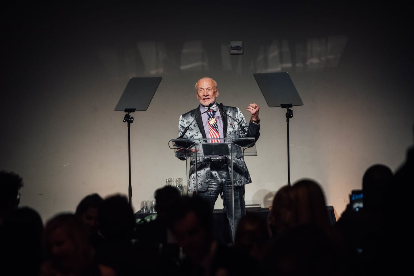 Former astronaut Buzz Aldrin speaking at the podium during the Global Green pre-Oscar gala