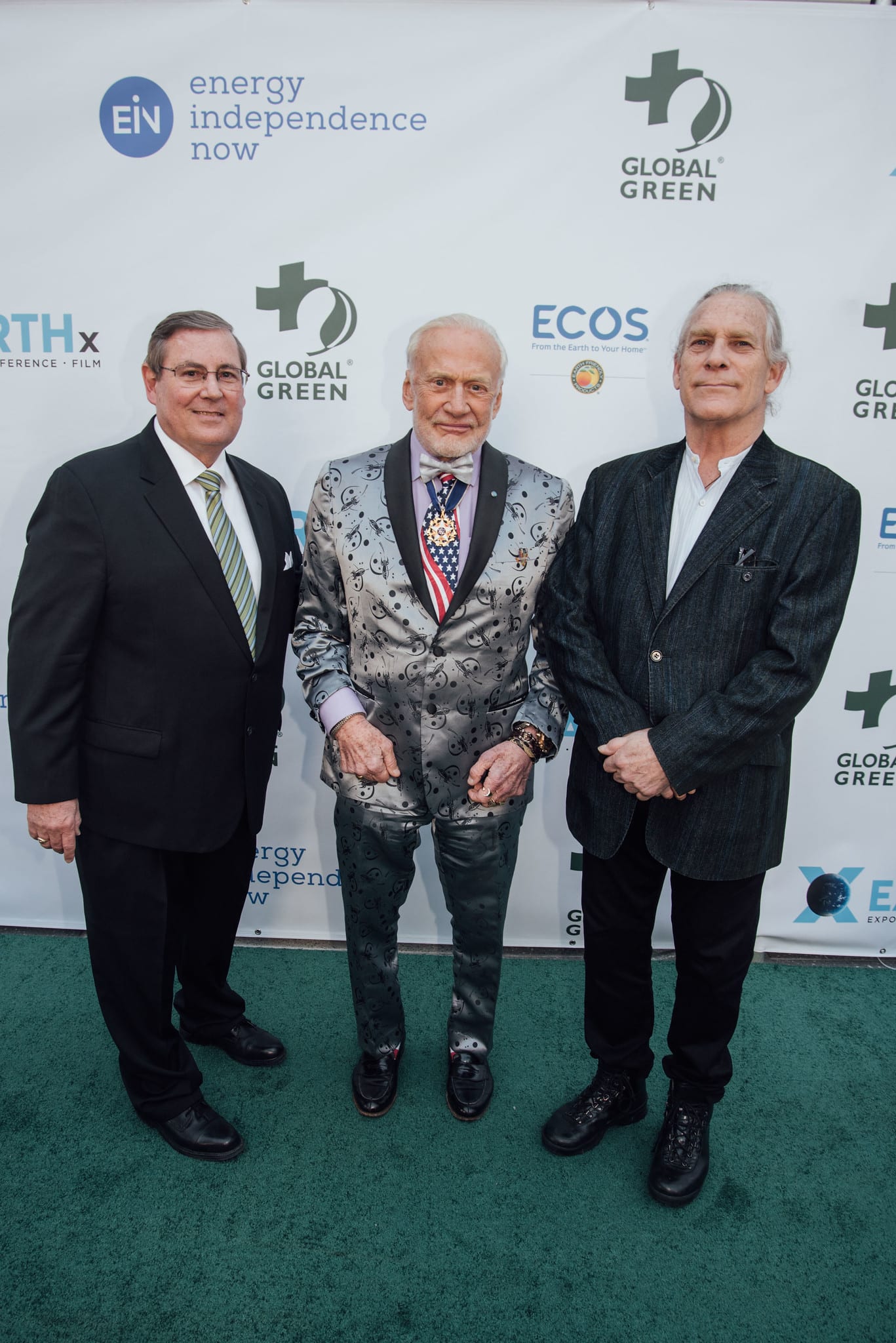 Former astronaut Buzz Aldrin photographed with two guests at the Global Green pre-Oscar gala