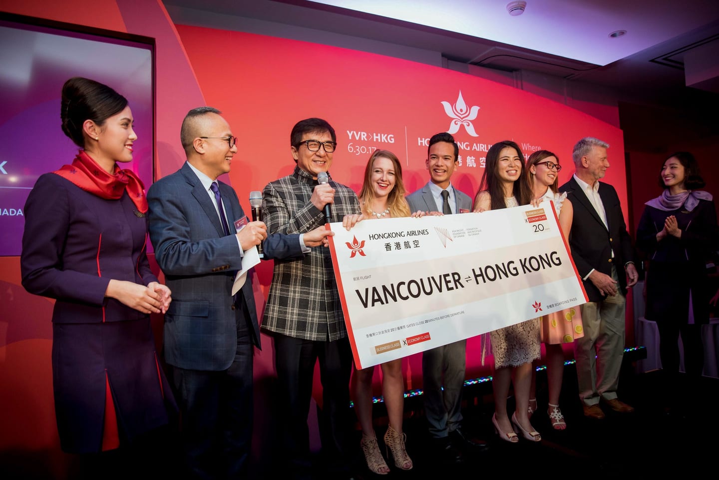 Oversized check presentation on stage at a corporate awards event