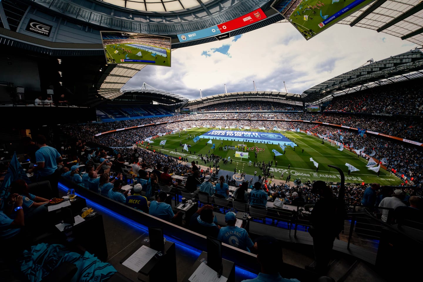 Manchester City supporters watching the Arsenal match on Cosm’s immersive stadium-scale screen in Inglewood