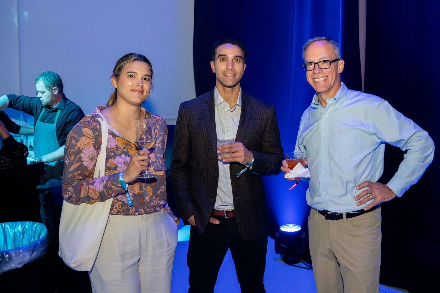 Three guests photographed together at the reveal