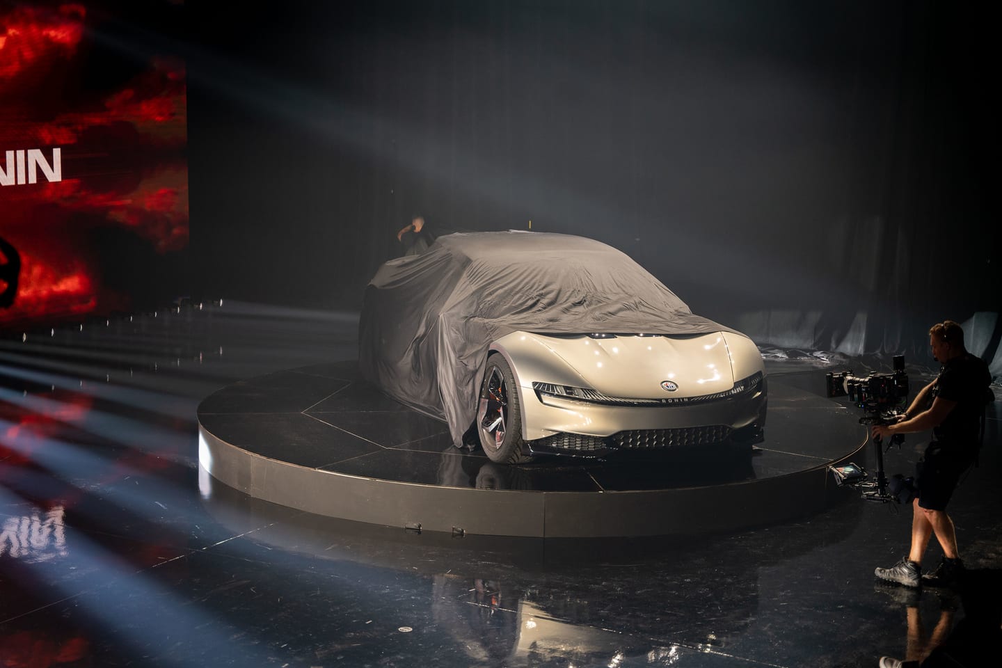A covered vehicle on the turntable ahead of the Ronin reveal