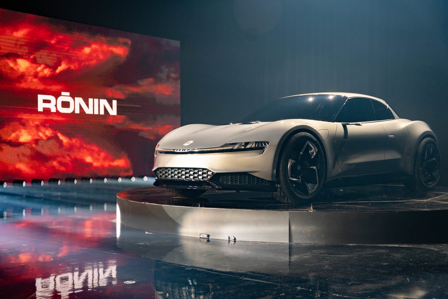 The Fisker Ronin on stage against a red RONIN screen