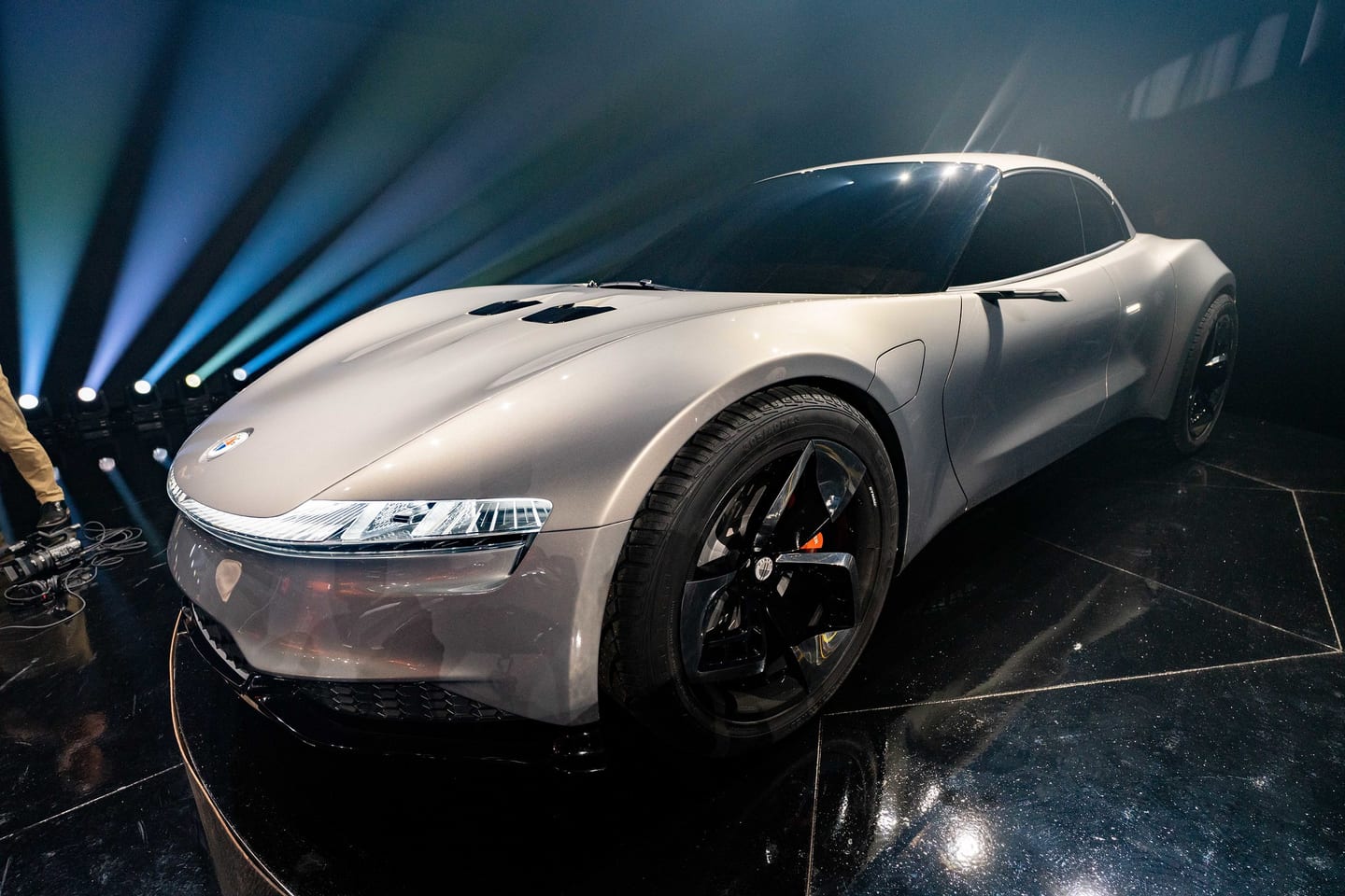 The silver Fisker Ronin grand tourer under stage lighting