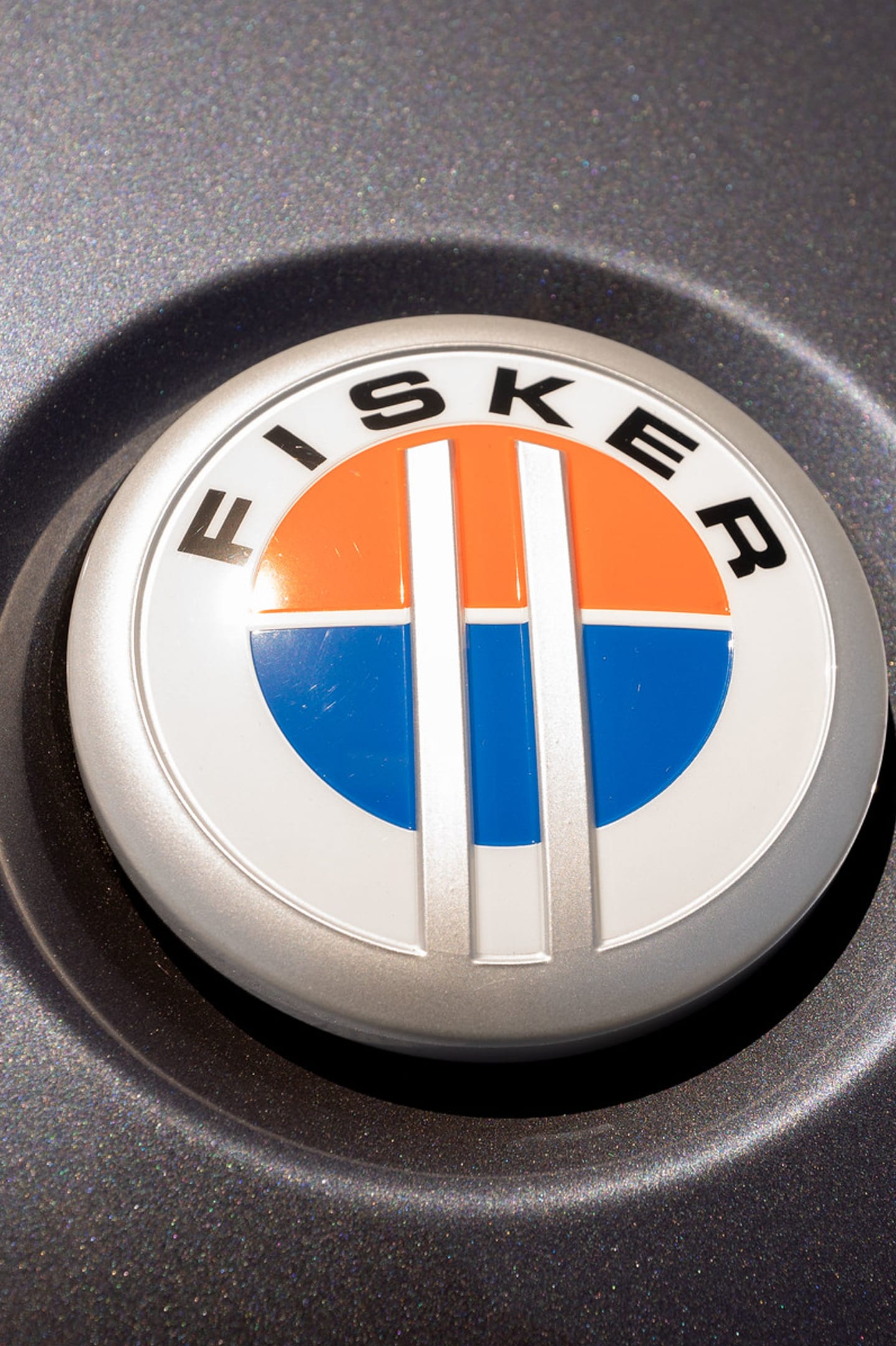 Close-up of the Fisker roundel badge on a wheel centre cap