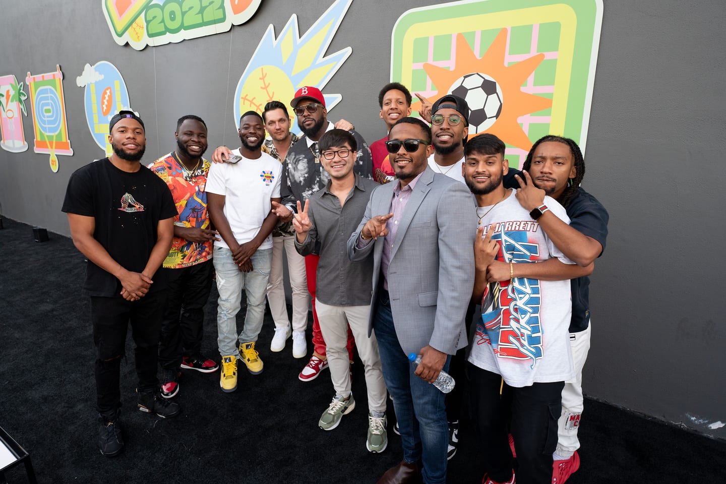 A large group of guests photographed together on the AOY 2022 carpet