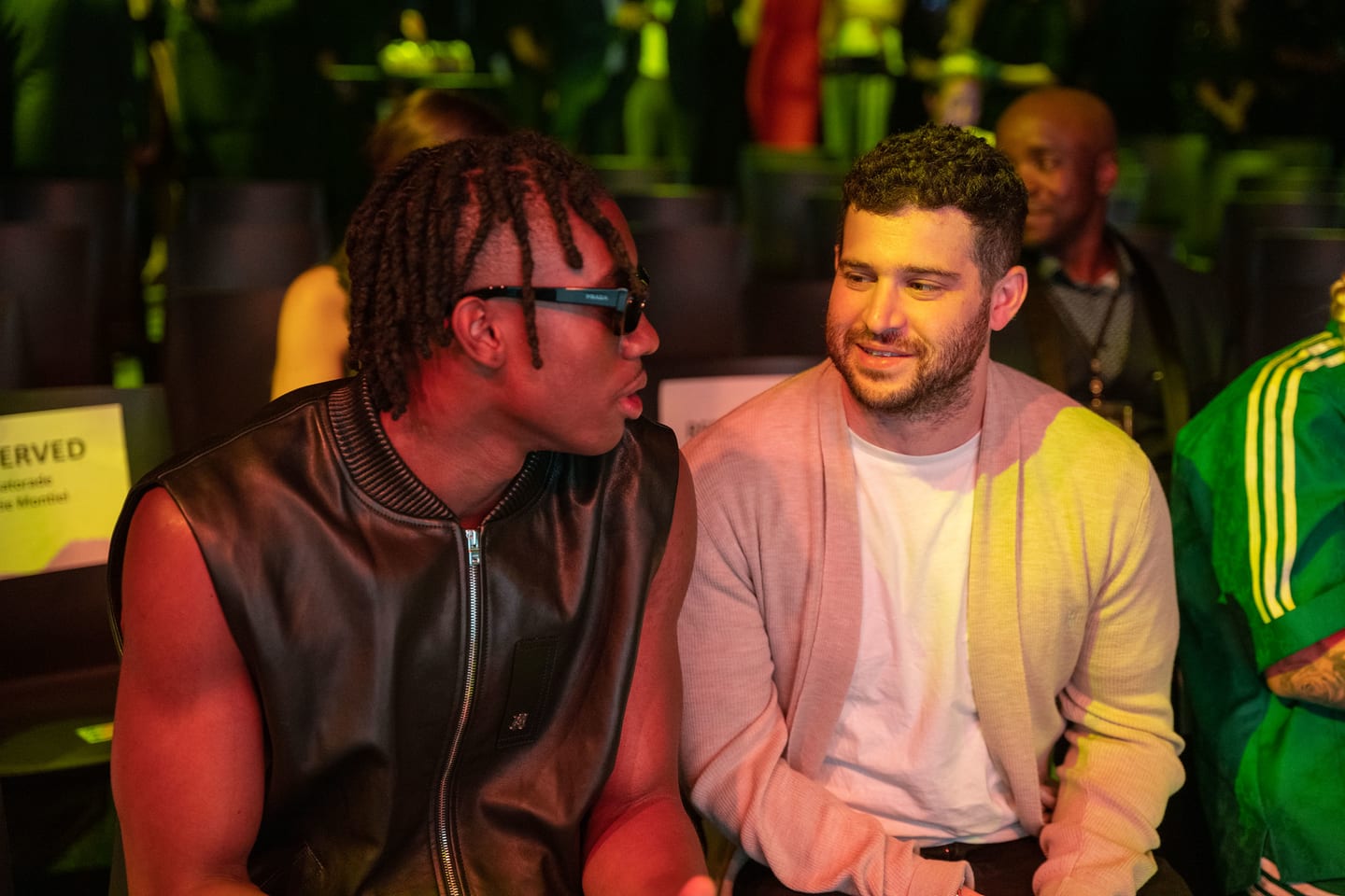 Two guests talking at a table during the party