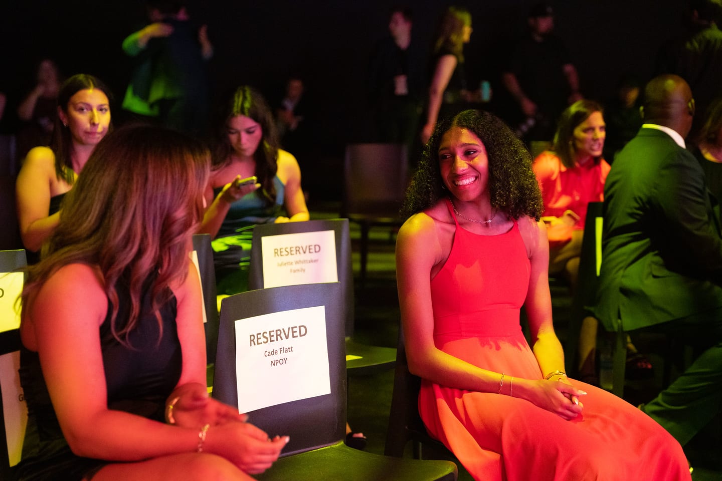 Guests seated at reserved tables during the evening program