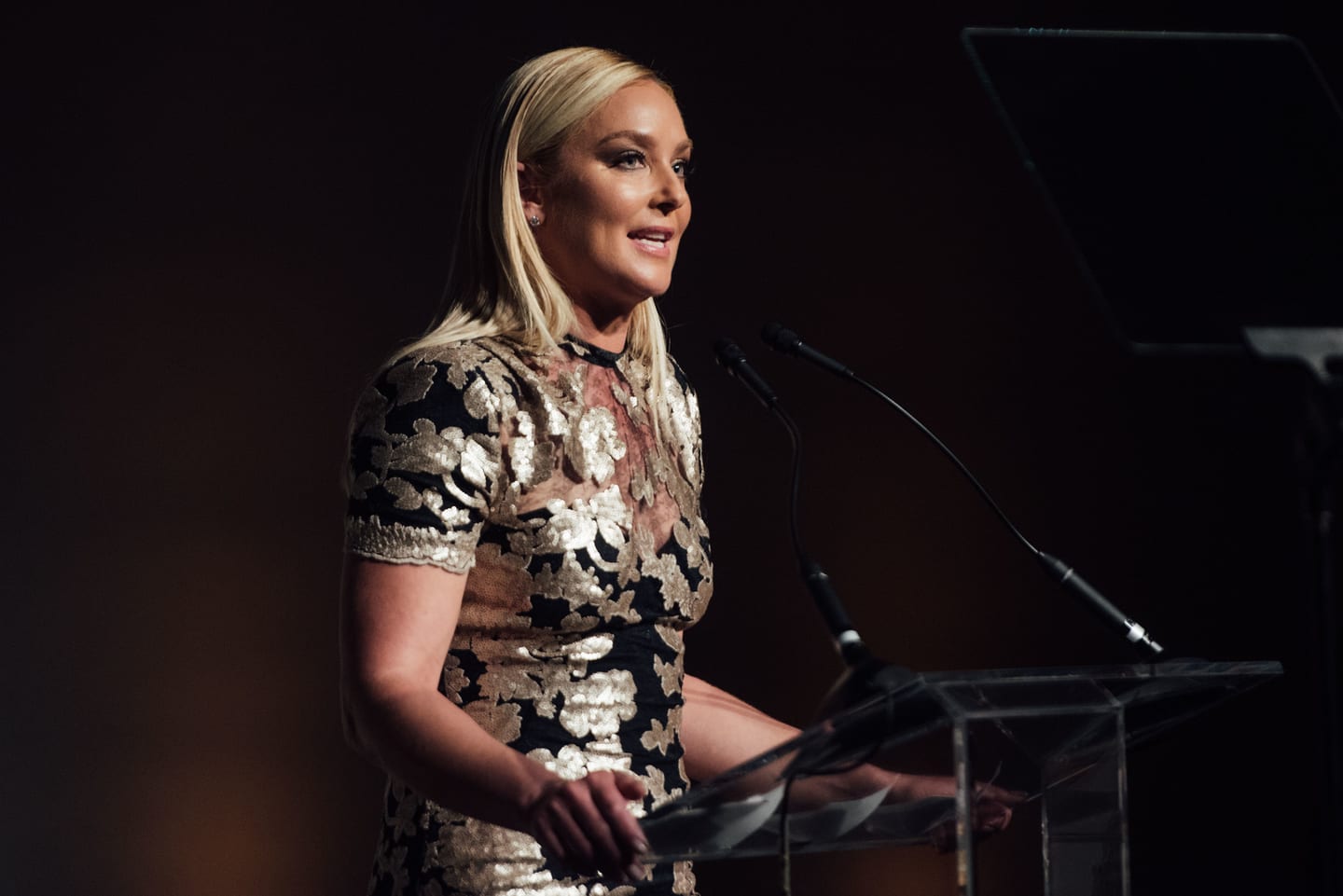 A speaker addressing the room from the podium at the 15th annual Global Green pre-Oscar gala at NeueHouse Hollywood