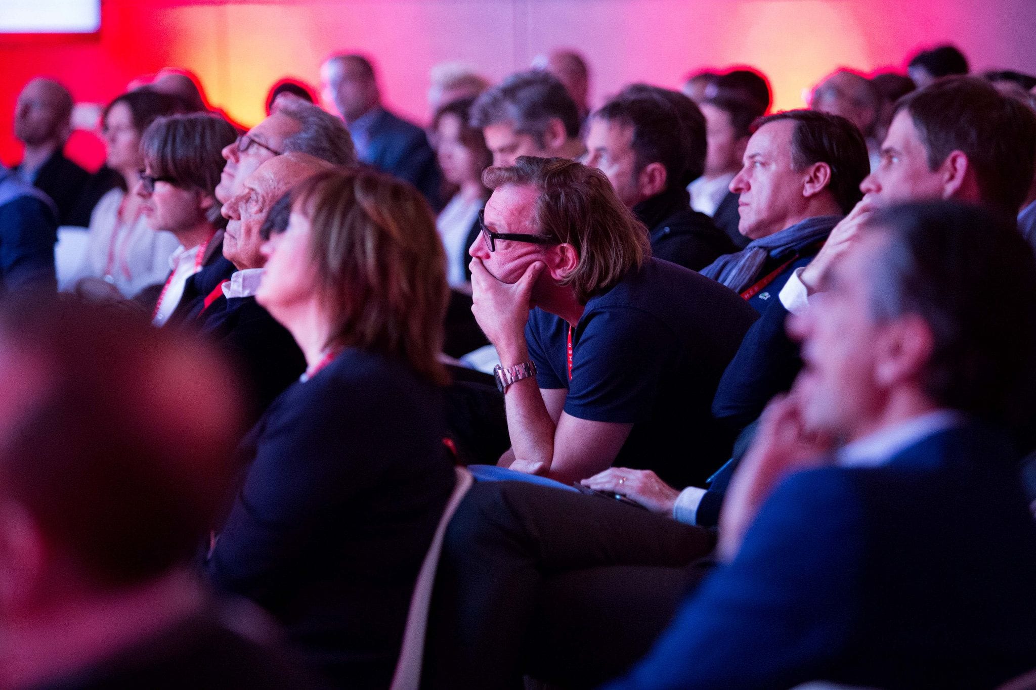 Engaged audience under colored light at a Havas Media conference in Century City