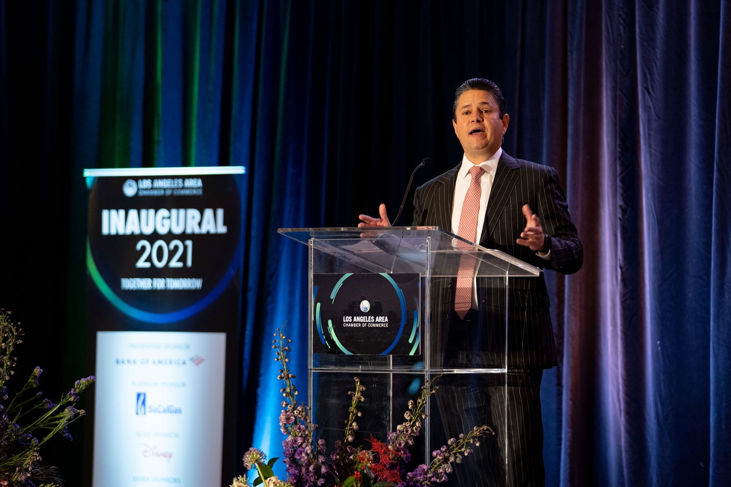A speaker at the Los Angeles Area Chamber of Commerce podium during the Inaugural 2021 keynote