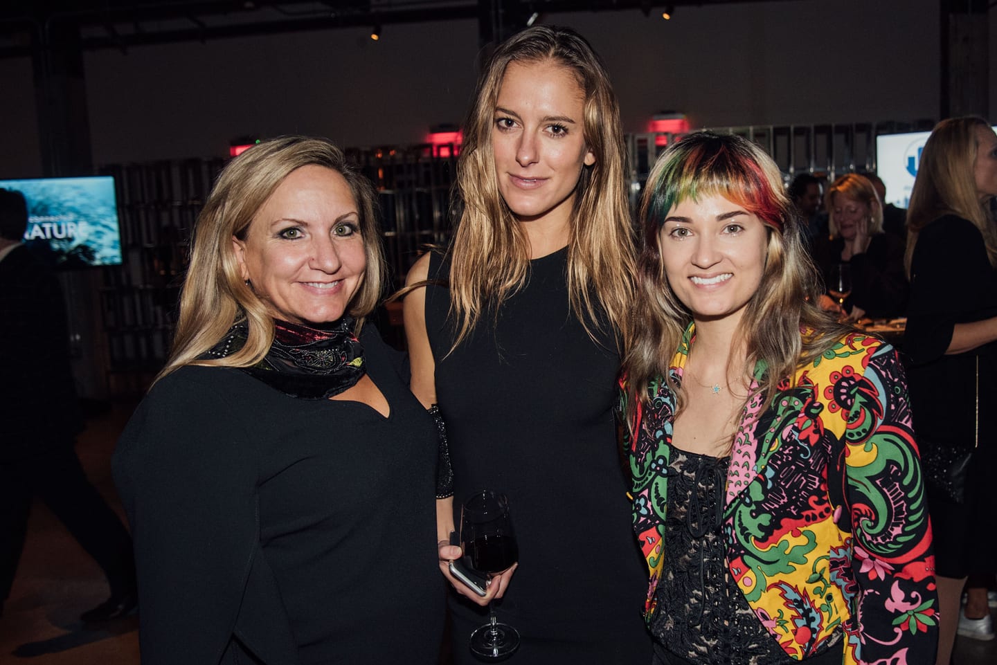 Recording artist Lauren Ruth Ward in a vivid patterned jacket with guests at the Global Green pre-Oscar gala