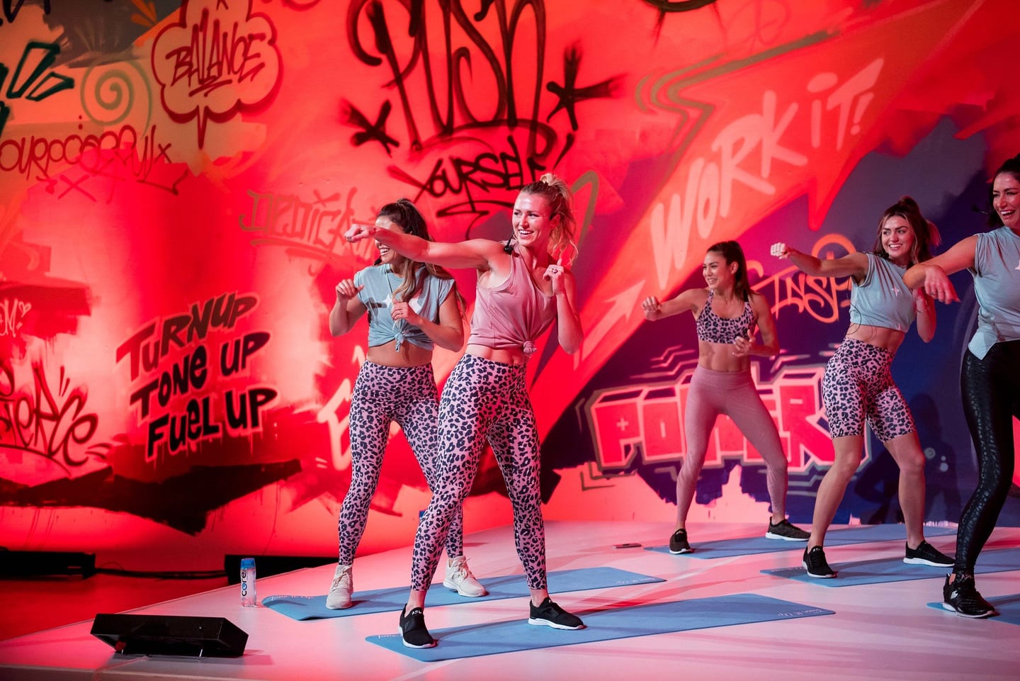 Performers on the PopSugar Body Garage stage