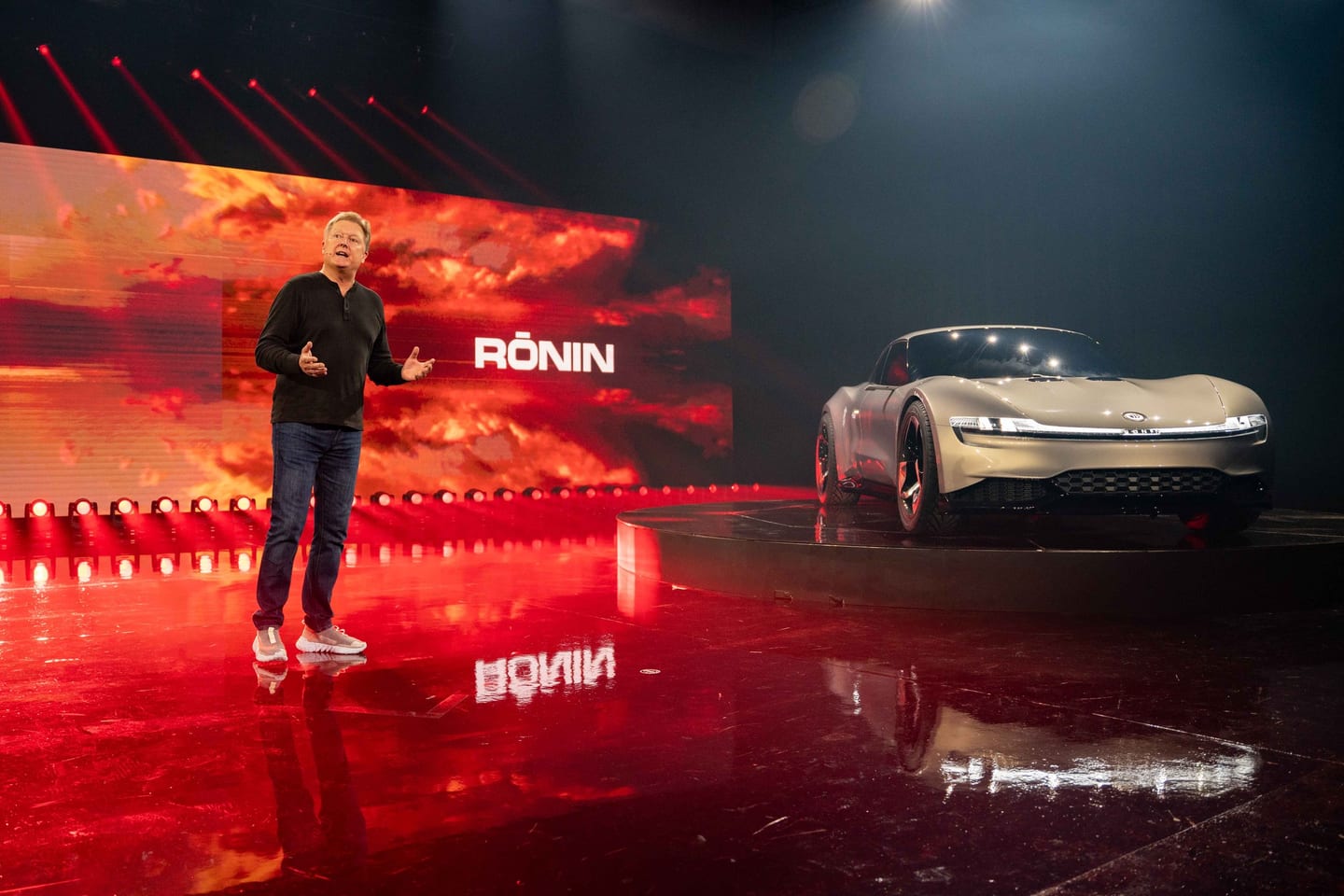 Dramatic auto reveal on a reflective stage