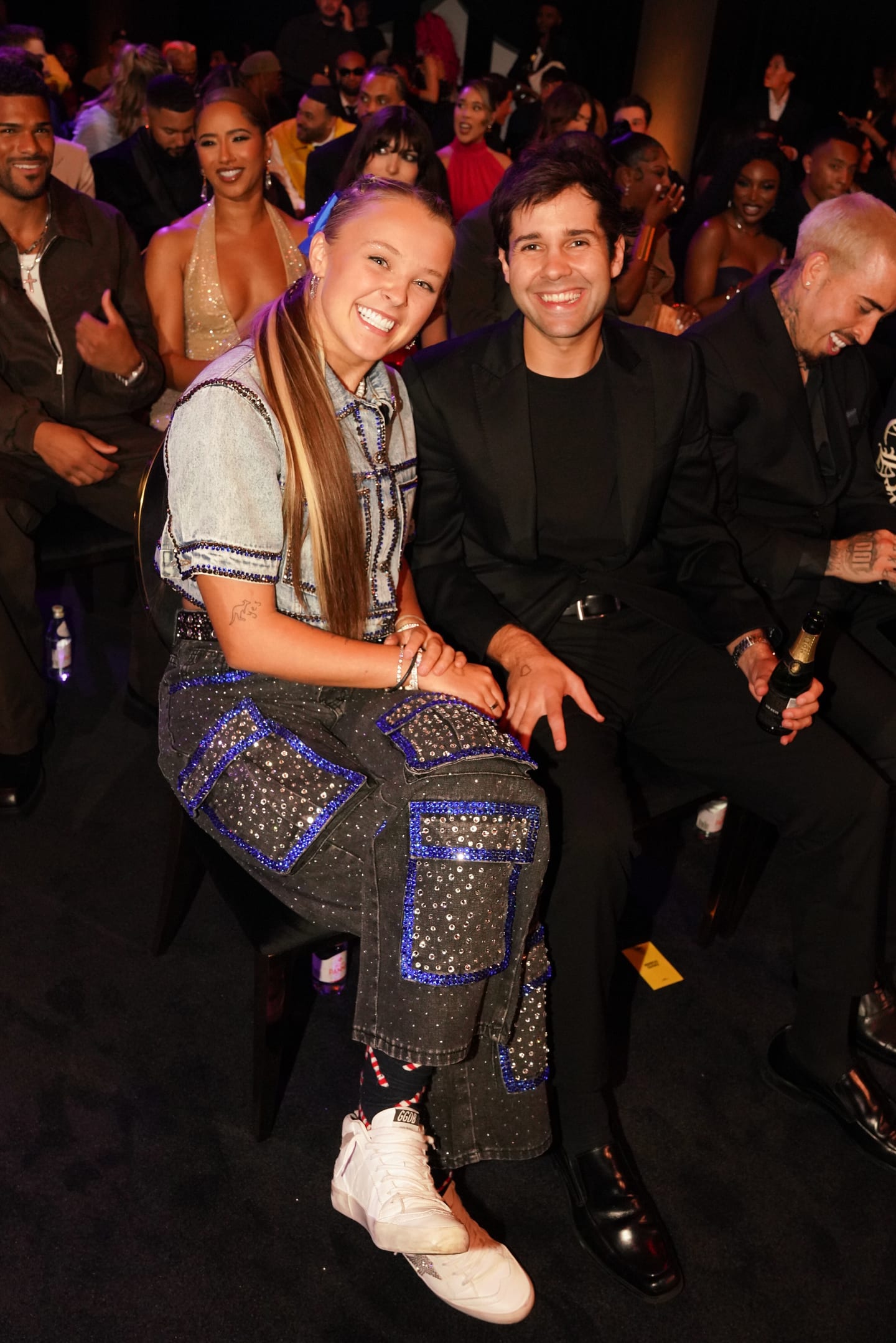Two guests seated together in the audience