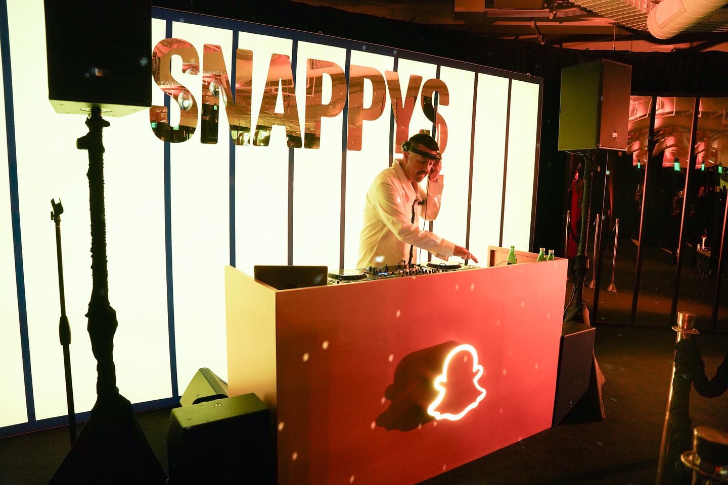 The SNAPPYS bar lit in red with the Snapchat ghost logo on its front